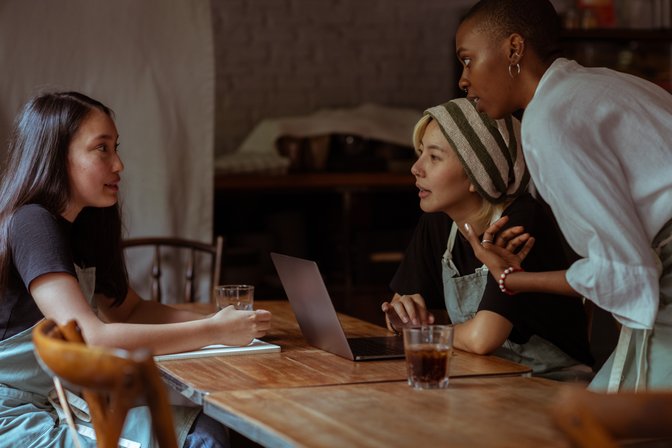 A group of women engaged in a discussion.